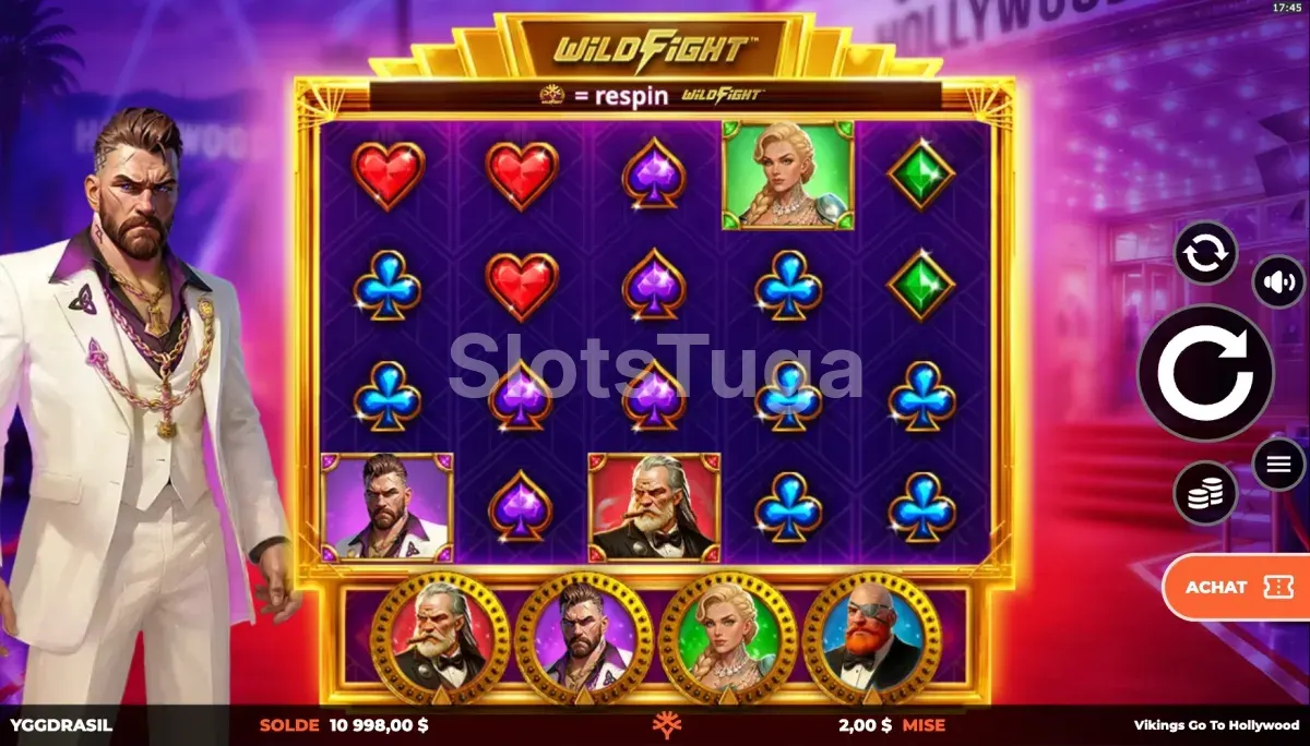 Vikings Go To Hollywood em jogo base: grelha de cinco por quatro com naipes de cartas coloridos e retratos de vikings, o aviso WildFight respin no topo, os quatro medidores de fama em medalhões dourados por baixo e um viking de fato branco à esquerda, sobre uma passadeira vermelha.
